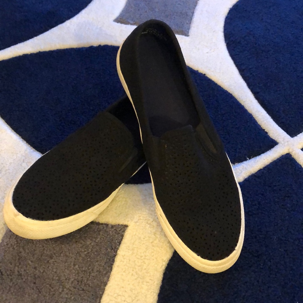 Black Sperry sneakers with lace like detail